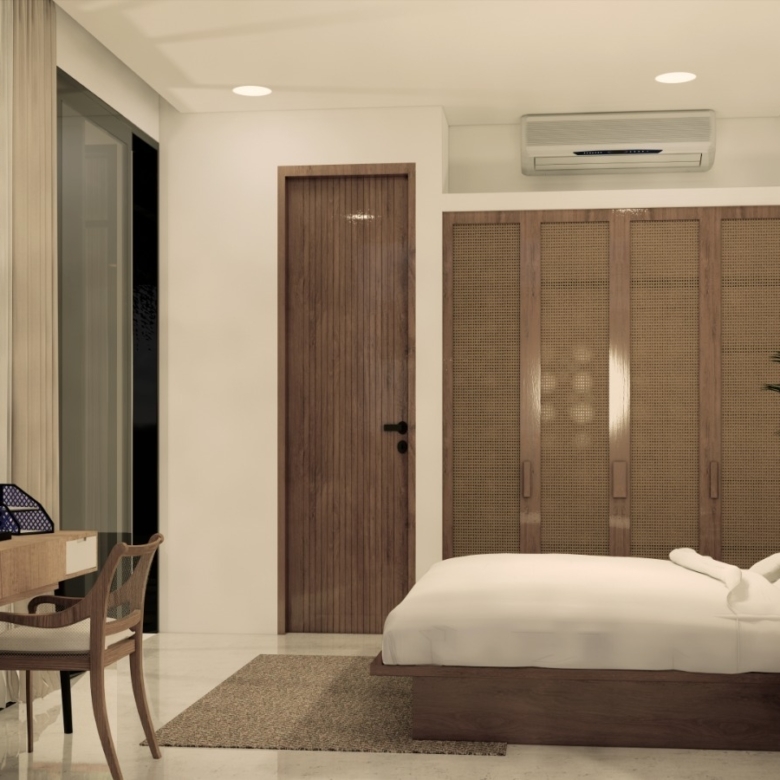 Hotel bedroom with a low wooden bed, white bedding, carved decorative walls, and a large woven-wood wardrobe.