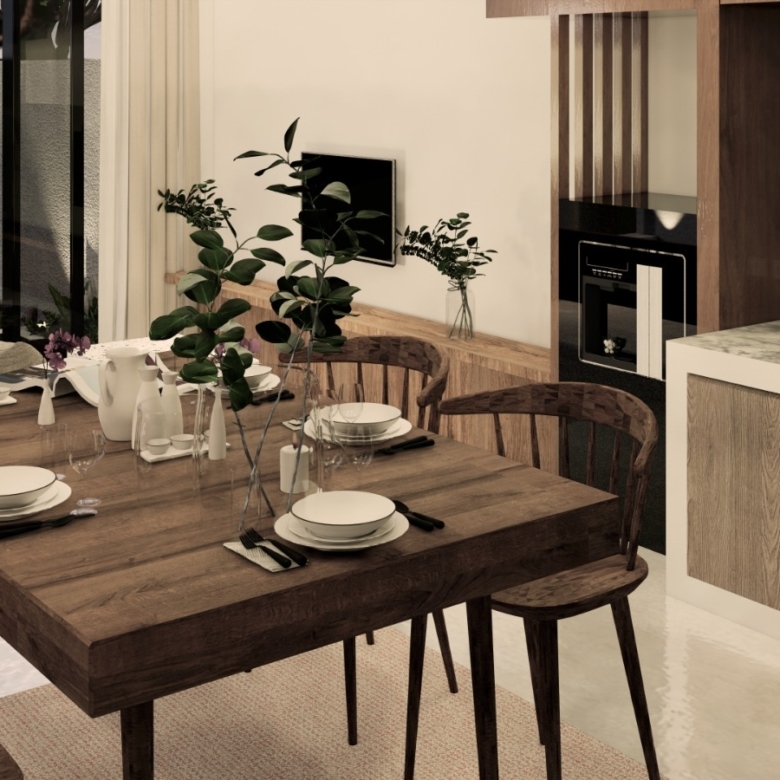 Wooden dining table set for a meal with plates, glasses, and cutlery in a modern kitchen-dining space.