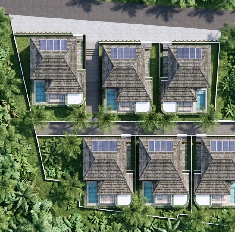 Aerial view of eight townhouses arranged in two rows around a central road, surrounded by dense tropical greenery, with solar panels on some roofs.