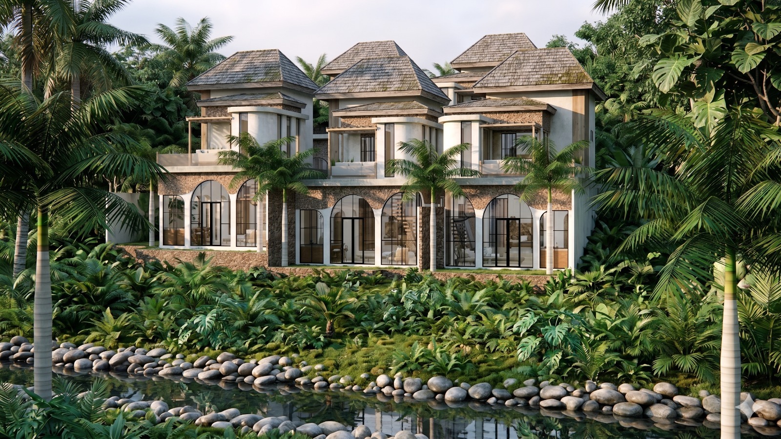 Luxurious tropical villa complex with thatched roofs, glass arches, and lush jungle landscaping beside a pebble-lined stream.
