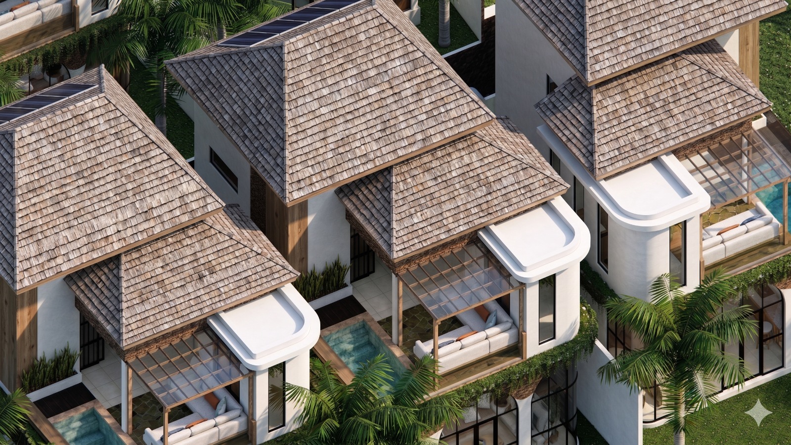 Aerial view of tropical villas with layered thatched roofs, glass sunrooms, and private seating terraces among palm trees.