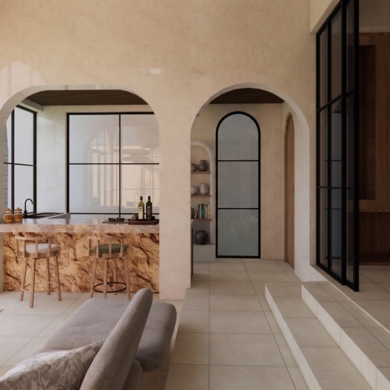 Open-concept kitchen and living area with arched doorways, a stone island, and large glass walls overlooking a palm-filled yard.