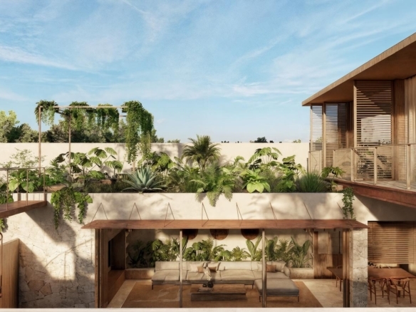 Modern courtyard with lush tropical plants and stone walls, open-air living space under a wooden pergola.