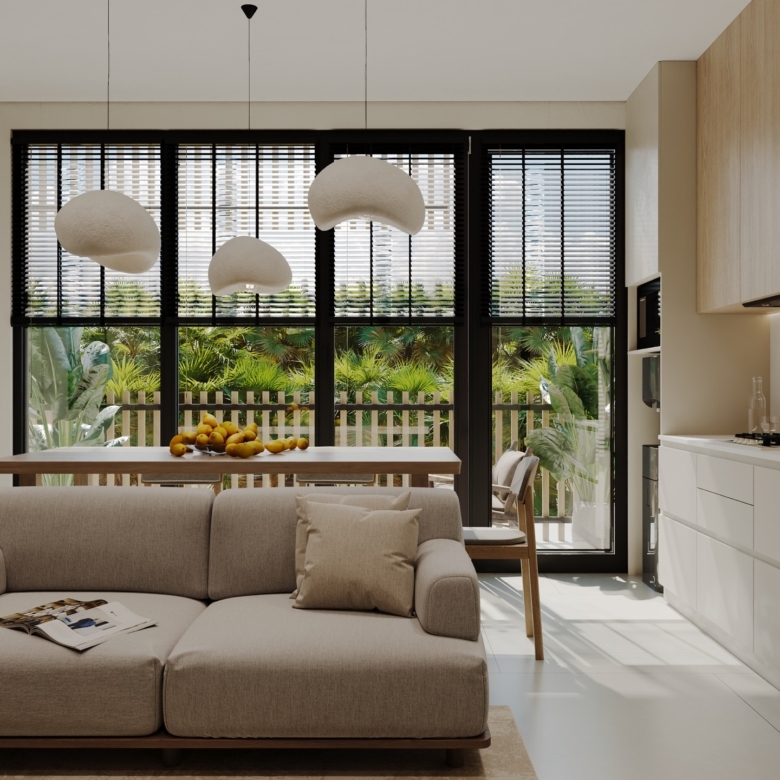 Bright open-plan living room with a beige sofa, coffee table and lemons on a wooden table; large black-framed windows with blinds reveal a garden outside.