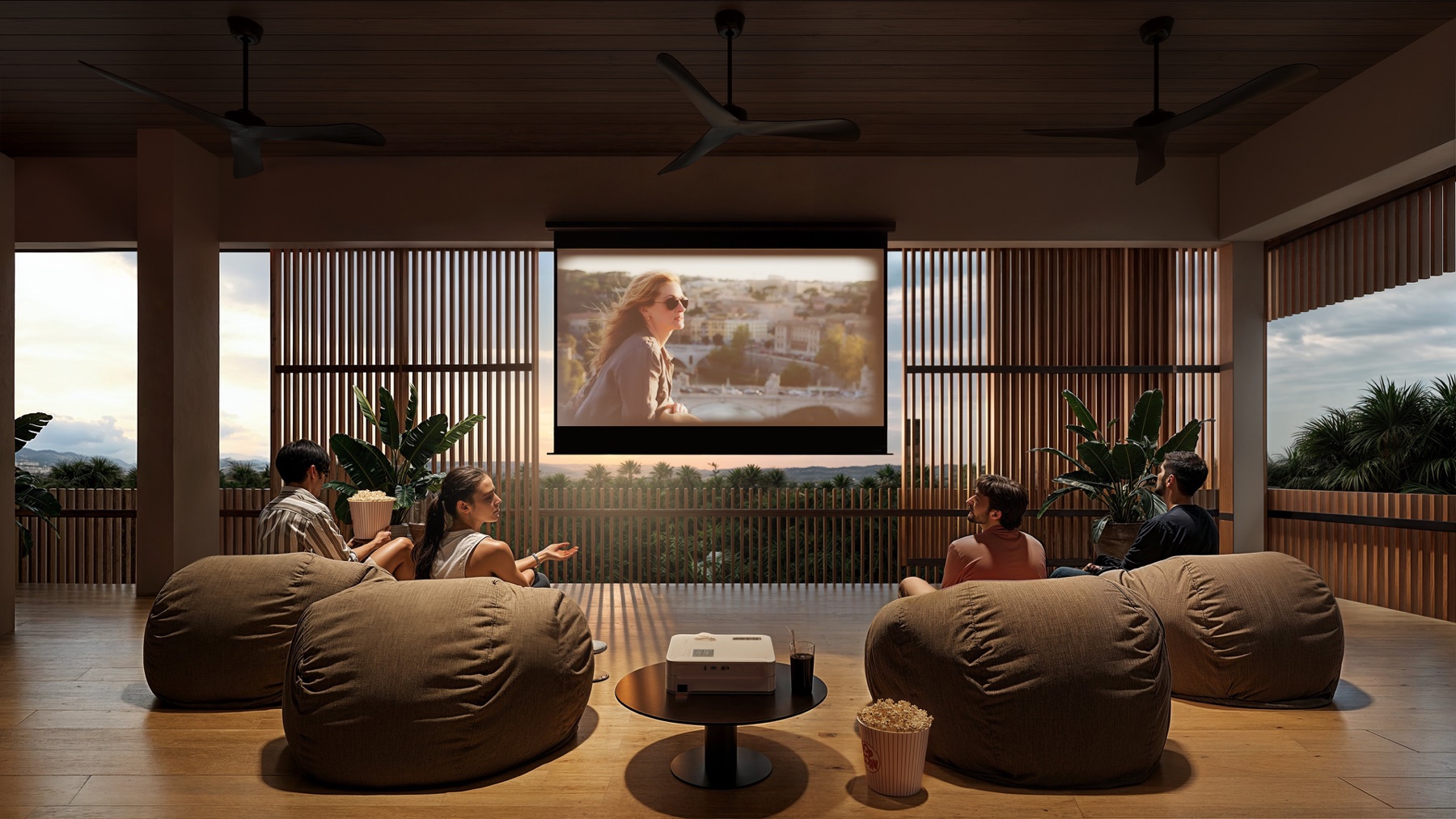 08_Concept_Visualization_Rooftop_Cinema Four friends lounge on bean bags in a modern open living area, watching a movie projected on a screen as sunset lights the scene.
